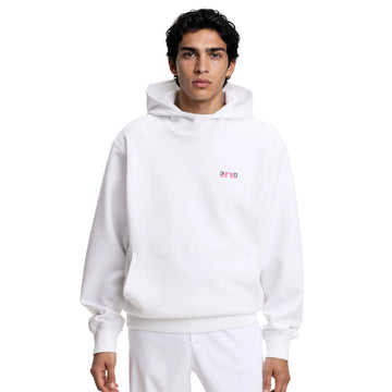 Person wearing a white hoodie with a small logo on a white background