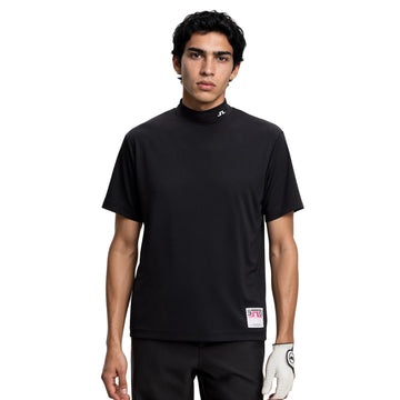 Man wearing a black turtleneck shirt with a logo on a white background